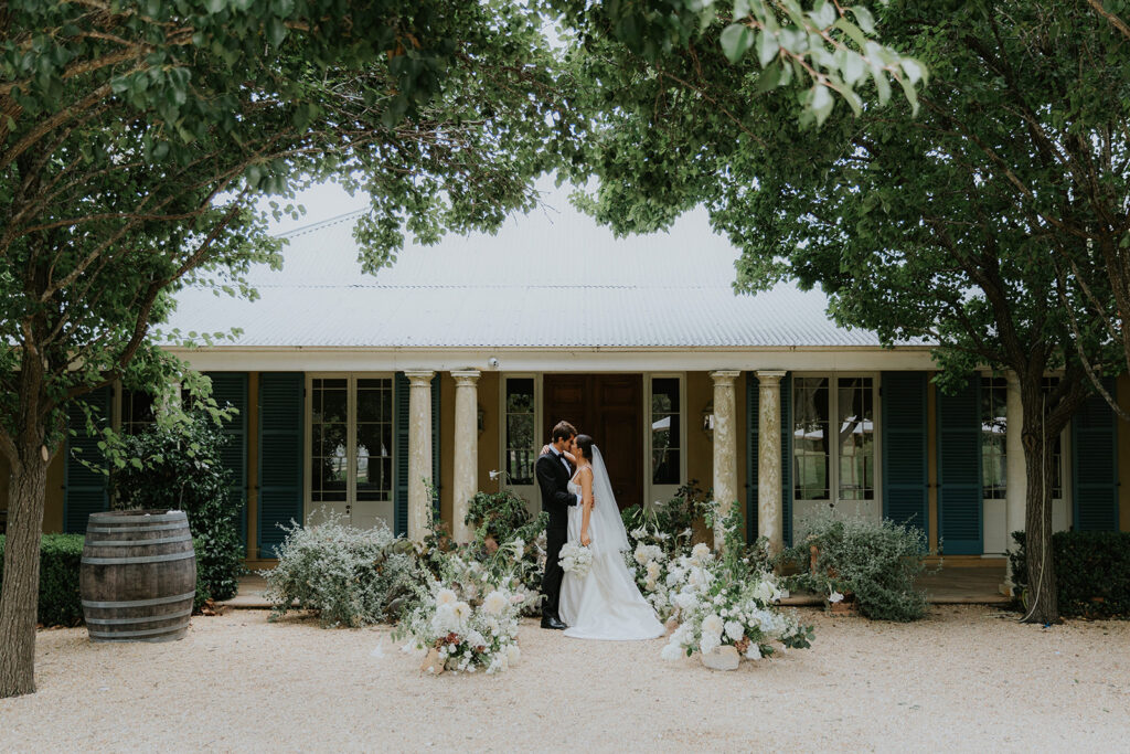 Eloping Couple set in front of Krinklewood estate a European Inspired Elopement with cascading florals