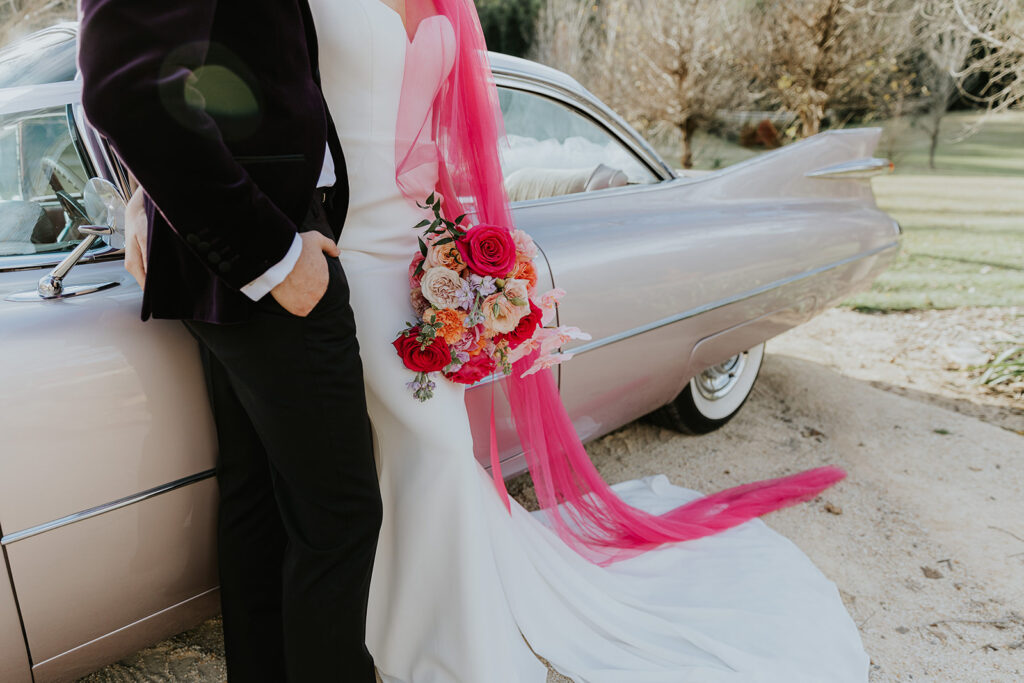 Elopement bold colourful couple in pink veil in Wollombi hunter valley wedding venue in classic mustang